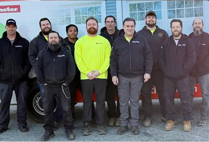 Fagan Door Systems technicians in front of a truck services